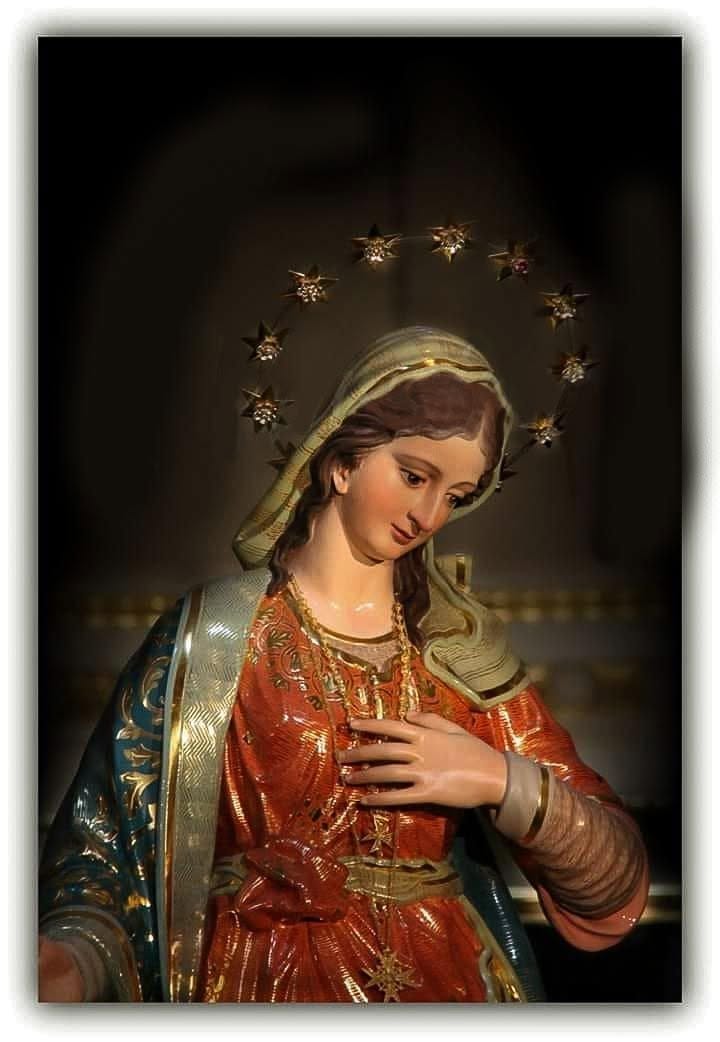 Mary’s statue against a dark background