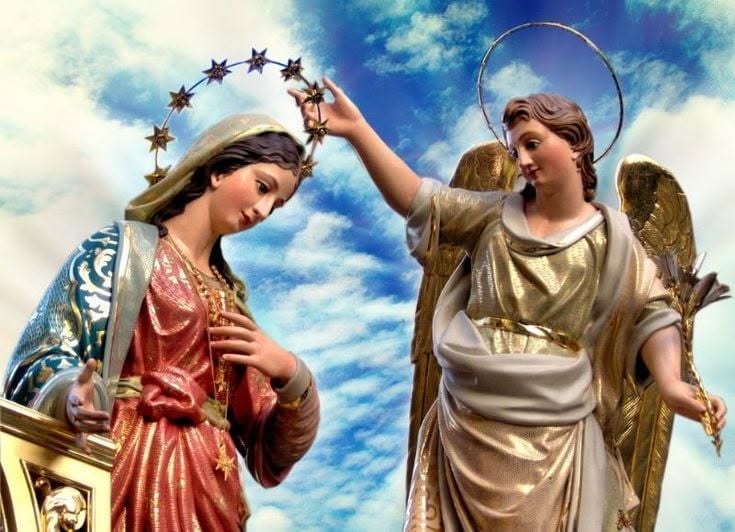 Mary and the angel against a blue sky