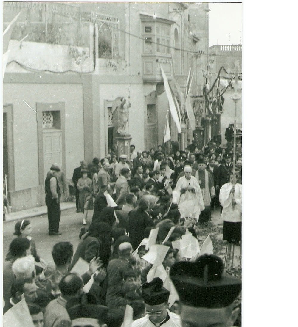 A procession along a decorated street