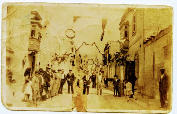 A decorated street in a sepia photograph