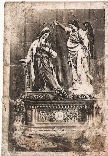An aged photograph of Annunciation statues